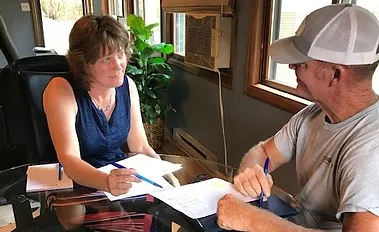 Wendy Fleener reviewing documents with a client during a tax-planning session