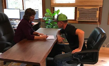 Wendy Fleener meeting with a client during a tax consultation